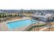 Community lap pool with adjacent clubhouse and landscaping at 5247 Flannery Chase Sw, Powder Springs, GA 30127