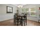 Bright dining room with four-chair table and large windows at 24 Thunderhawk Ne Ln, Rydal, GA 30171