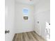 Laundry room with vinyl flooring and built in shelving at 1475 Auburn Glen Rd, Dacula, GA 30019