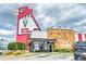 The Big Chicken restaurant is a landmark with its towering, iconic chicken head and classic Kentucky Fried Chicken branding at 3255 Hilltop Cir, Marietta, GA 30066