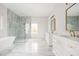 Luxurious bathroom with marble floors, double vanity, and large shower at 600 Jones Rd, Roswell, GA 30075