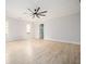 Spacious bedroom with hardwood floors and a ceiling fan at 600 Jones Rd, Roswell, GA 30075