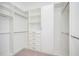 Bright walk-in closet with ample shelving and hanging space at 600 Jones Rd, Roswell, GA 30075