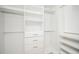 Spacious walk-in closet with custom built-ins at 600 Jones Rd, Roswell, GA 30075