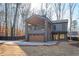 Modern farmhouse exterior with large windows and attached garage at 600 Jones Rd, Roswell, GA 30075