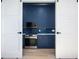 Modern kitchen with navy blue cabinets and white walls at 600 Jones Rd, Roswell, GA 30075