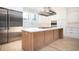 Kitchen features a large island with light wood and white countertops at 600 Jones Rd, Roswell, GA 30075