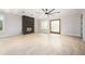 Bright living room with hardwood floors, stone fireplace, and natural light at 600 Jones Rd, Roswell, GA 30075