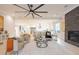 Open concept living room with hardwood floors and a stone fireplace at 600 Jones Rd, Roswell, GA 30075