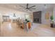 Open concept living room with hardwood floors and a stone fireplace at 600 Jones Rd, Roswell, GA 30075