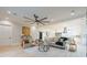 Open concept living room with hardwood floors and a stone fireplace at 600 Jones Rd, Roswell, GA 30075