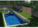 Backyard pool and spa design with stone coping at 600 Jones Rd, Roswell, GA 30075