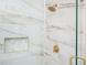 Shower with marble tile and gold fixtures at 600 Jones Rd, Roswell, GA 30075