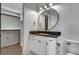 Bathroom with white vanity, dark countertop and walk-in closet at 884 Derrydown Way, Decatur, GA 30030