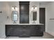 Double vanity bathroom with dark cabinetry and quartz countertops at 884 Derrydown Way, Decatur, GA 30030