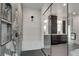 Spa-like bathroom featuring a large shower, double vanity, and dark cabinetry at 884 Derrydown Way, Decatur, GA 30030