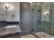 Spa-like bathroom with green tile shower and dark vanity at 884 Derrydown Way, Decatur, GA 30030