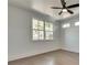 Bright bedroom with hardwood floors, large windows, and ceiling fan at 884 Derrydown Way, Decatur, GA 30030