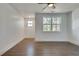 Well-lit bedroom with hardwood floors and large window at 884 Derrydown Way, Decatur, GA 30030