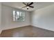 Bright bedroom with hardwood floors, large window, and ceiling fan at 884 Derrydown Way, Decatur, GA 30030