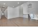 Light hardwood floors and bright neutral walls in a long hallway at 884 Derrydown Way, Decatur, GA 30030