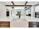 Modern farmhouse kitchen with white quartz countertops and a farmhouse sink at 884 Derrydown Way, Decatur, GA 30030