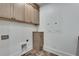 Laundry room with cabinets and electrical panel at 884 Derrydown Way, Decatur, GA 30030