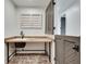 Laundry room with farmhouse style sink and cabinets at 884 Derrydown Way, Decatur, GA 30030