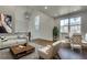 Bright living room with hardwood floors, modern furniture, and large windows at 884 Derrydown Way, Decatur, GA 30030