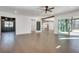 Open living space with hardwood floors, and views into kitchen and backyard at 884 Derrydown Way, Decatur, GA 30030