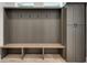 Gray mudroom with bench, cubbies, and hooks at 884 Derrydown Way, Decatur, GA 30030