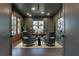 Stylish home office boasts dark walls, hardwood floors, and modern furniture at 884 Derrydown Way, Decatur, GA 30030