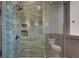 Walk-in shower with green tile and glass enclosure at 884 Derrydown Way, Decatur, GA 30030