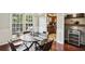 Dining room with modern table set and view into the kitchen at 29 La Rue Nw Pl, Atlanta, GA 30327