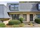 Charming townhome featuring a well-maintained yard and classic architectural details at 29 La Rue Nw Pl, Atlanta, GA 30327