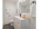 Simple bathroom with white vanity and dark grey floor at 2740 Flagstone Se Dr, Atlanta, GA 30316