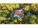 Overhead aerial view of the home showcasing its layout on an expansive lot surrounded by mature trees at 1416 Walcutts Nw Way, Marietta, GA 30064