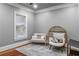 Cozy bedroom featuring a sitting area with comfortable and stylish chairs at 1416 Walcutts Nw Way, Marietta, GA 30064