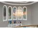 Foyer featuring a large chandelier, arched windows, and elegant artwork at 1416 Walcutts Nw Way, Marietta, GA 30064