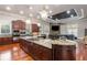 Open kitchen with stone accents, granite countertops, and premium appliances at 1416 Walcutts Nw Way, Marietta, GA 30064