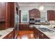 Gourmet kitchen with granite countertops, stainless steel appliances, and custom cabinetry at 1416 Walcutts Nw Way, Marietta, GA 30064