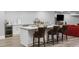 Basement kitchenette featuring modern cabinets, quartz countertops, wine fridge, and seating at 1416 Walcutts Nw Way, Marietta, GA 30064