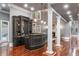 Entertaining space featuring a bar and view into a living room and fireplace at 1416 Walcutts Nw Way, Marietta, GA 30064