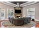 Cozy living area with stone fireplace, comfortable seating, and abundant natural light at 1416 Walcutts Nw Way, Marietta, GA 30064