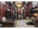 Sophisticated home office with rich wood paneling, custom built-ins, and ample workspace at 1416 Walcutts Nw Way, Marietta, GA 30064