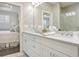 Bathroom with double vanity sinks and a view to the bedroom at 2341 Brissett Ln, Brookhaven, GA 30319