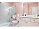 Bathroom featuring a glass enclosed stand up shower with marble surround and a white vanity with lots of storage at 2341 Brissett Ln, Brookhaven, GA 30319