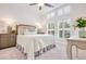 Inviting bedroom with large windows, plantation shutters, soft carpet, and a comfortable bed with decorative pillows at 2341 Brissett Ln, Brookhaven, GA 30319