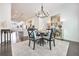 Chandelier-lit dining room with gold accents and barstool seating at kitchen counter at 2341 Brissett Ln, Brookhaven, GA 30319