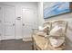Hallway features a decorative wooden bench with plush pillows and beautiful dark hardwood floors at 2341 Brissett Ln, Brookhaven, GA 30319